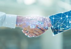 Professional teamwork and network connection technology concept, Double exposure of arab Business man handshake to his business partner with digital graphic against city night background in meeting